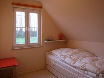 Ein Schlafzimmer im  Ferienhaus Silbermöwe
