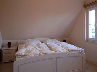 Ein Schlafzimmer im  Ferienhaus Silbermöwe
